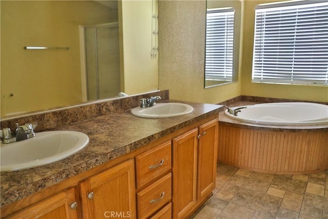 1201 S St, Corning, CA 96021 - bathroom with double vanity, a garden tub, a stall shower, and stone finish flooring