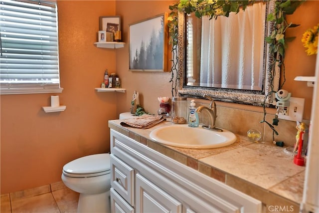 1201 S St, Corning, CA 96021 - bathroom featuring toilet, vanity, and tile patterned flooring