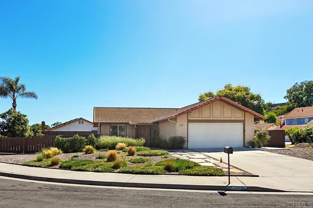 4616 Arrowhead Ct, Oceanside, CA 92056 - ranch-style house featuring a tiled roof, an attached garage, driveway, and stucco siding