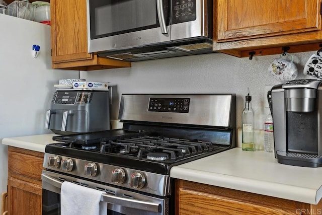 4616 Arrowhead Ct, Oceanside, CA 92056 - kitchen with appliances with stainless steel finishes, brown cabinets, and light countertops