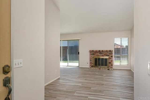4616 Arrowhead Ct, Oceanside, CA 92056 - unfurnished living room with a fireplace, baseboards, and wood finished floors