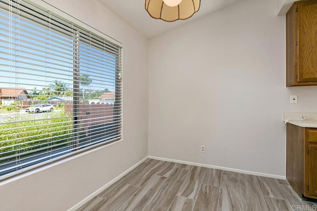4616 Arrowhead Ct, Oceanside, CA 92056 - unfurnished dining area with light wood-style flooring and baseboards