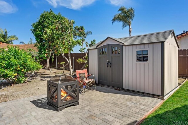 4616 Arrowhead Ct, Oceanside, CA 92056 - fenced backyard featuring a fire pit and a patio area