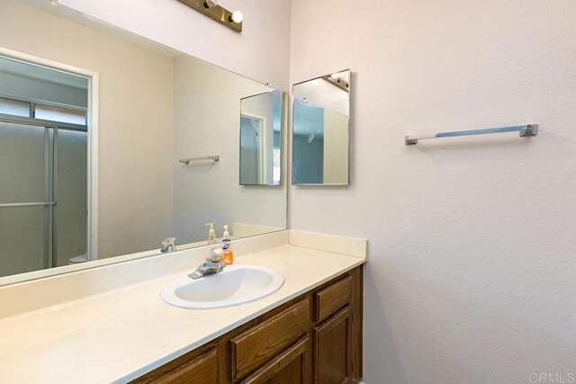 4616 Arrowhead Ct, Oceanside, CA 92056 - full bathroom featuring vanity and a shower with door