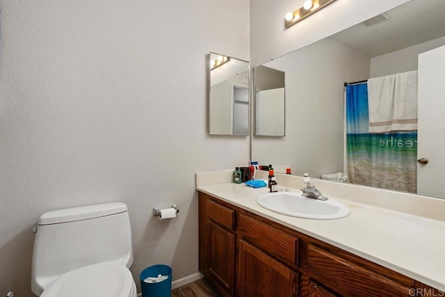 4616 Arrowhead Ct, Oceanside, CA 92056 - bathroom featuring vanity, toilet, curtained shower, and baseboards
