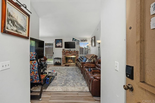 4616 Arrowhead Ct, Oceanside, CA 92056 - living area with a brick fireplace and wood finished floors