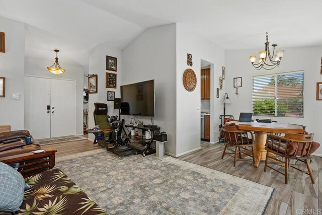 4616 Arrowhead Ct, Oceanside, CA 92056 - living room featuring a chandelier, light wood-style floors, vaulted ceiling, and baseboards