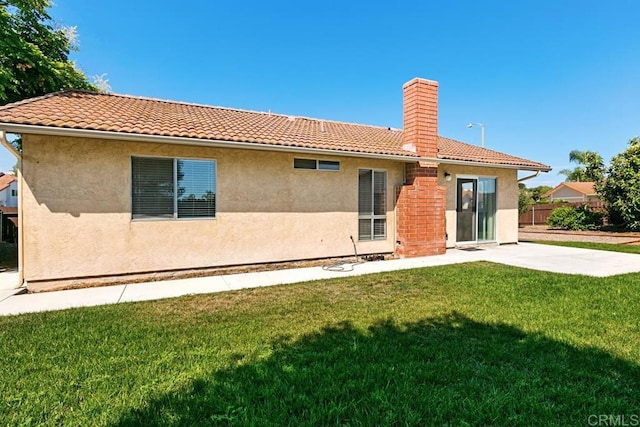 4616 Arrowhead Ct, Oceanside, CA 92056 - back of property with a chimney, stucco siding, a patio, and a tile roof