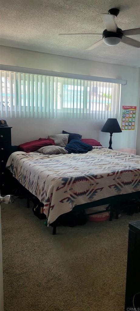 668 Farview St, El Cajon, CA 92021 - carpeted bedroom with a ceiling fan and a textured ceiling