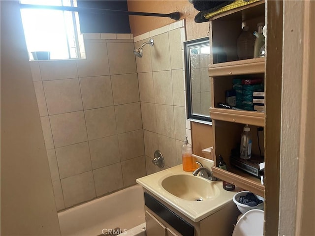 260 W 42nd Pl, Los Angeles, CA 90037 - bathroom featuring tub / shower combination, vanity, healthy amount of natural light, and toilet