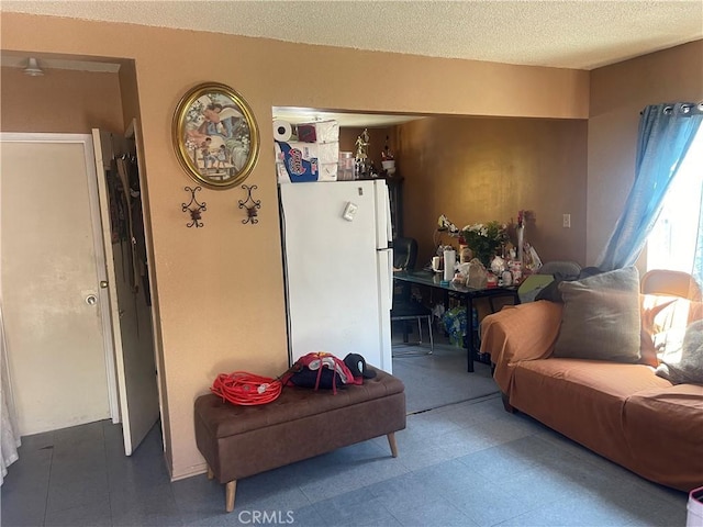 260 W 42nd Pl, Los Angeles, CA 90037 - living area with tile patterned floors and a textured ceiling