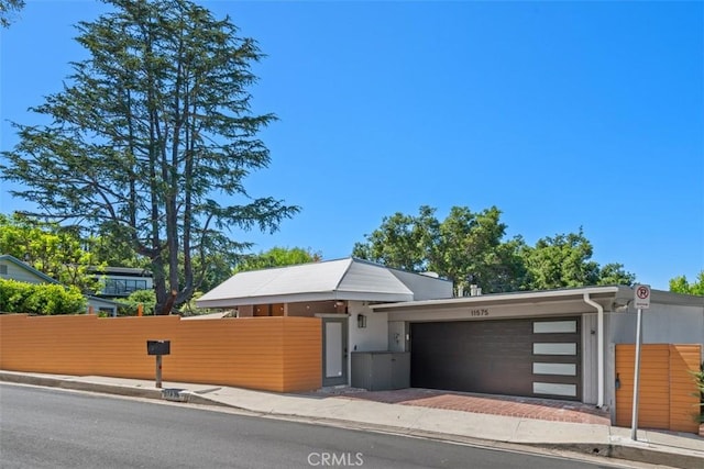 11575 Sunshine Ter, Studio City, CA 91604 - view of front of home featuring a garage, fence, and driveway