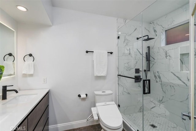 11575 Sunshine Ter, Studio City, CA 91604 - full bathroom with a marble finish shower, toilet, vanity, baseboards, and recessed lighting