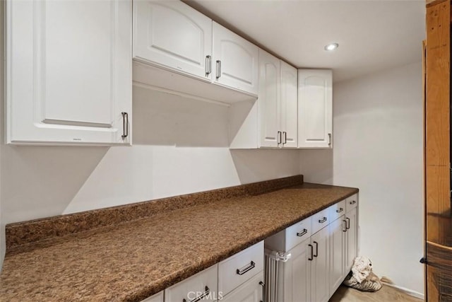 11575 Sunshine Ter, Studio City, CA 91604 - kitchen with dark countertops, white cabinets, and recessed lighting