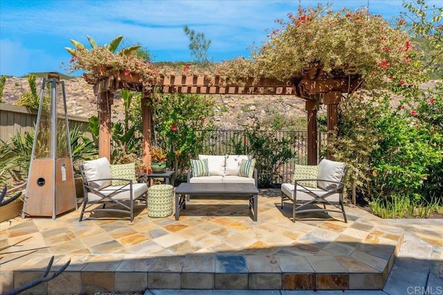 view of patio / terrace featuring an outdoor hangout area, fence, and a pergola