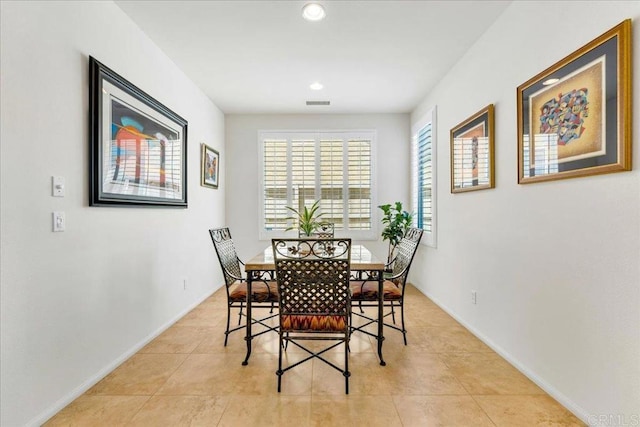dining room featuring light tile patterned flooring, recessed lighting, and baseboards
