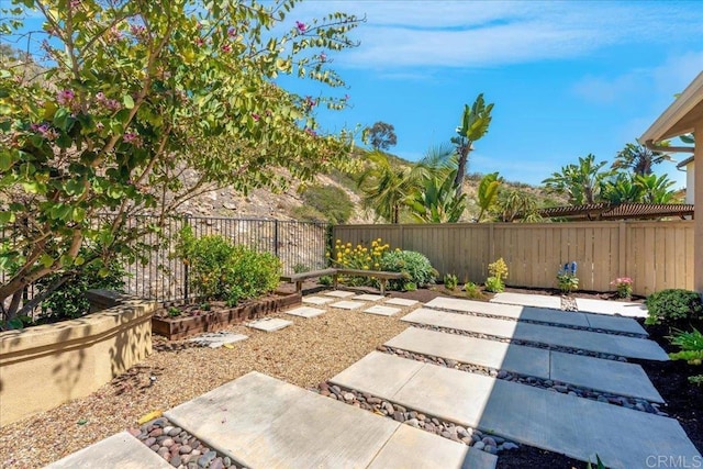 fenced backyard featuring a patio area