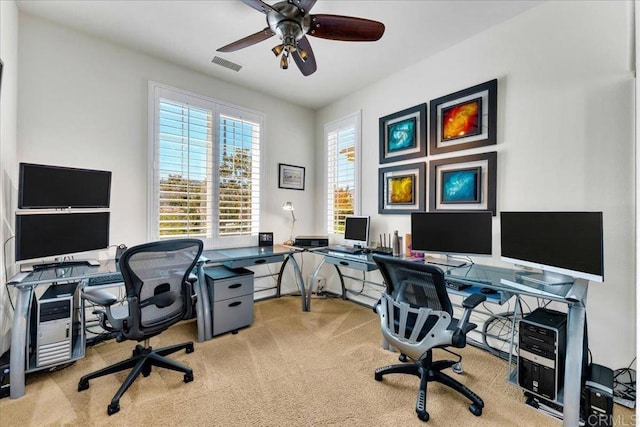office space with carpet and ceiling fan