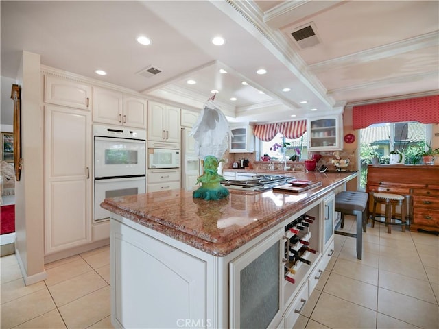5338 Falling Tree Ln, Rancho Cucamonga, CA 91737 - kitchen featuring ornamental molding, white appliances, stone counters, a tray ceiling, and glass insert cabinets