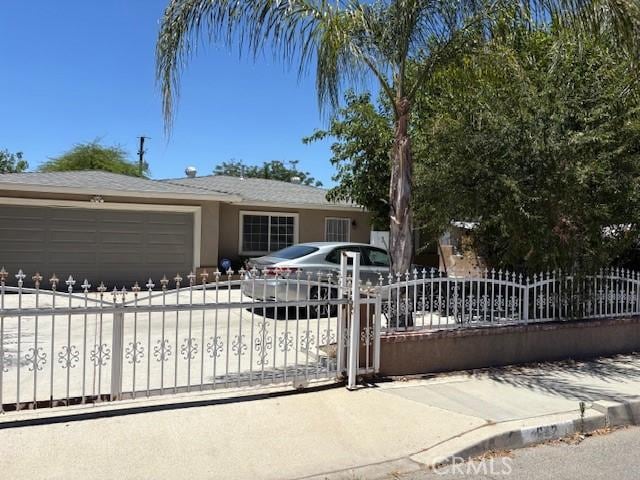 642 S Rosario Ave, San Jacinto, CA 92583 - single story home with a fenced front yard, an attached garage, driveway, and stucco siding