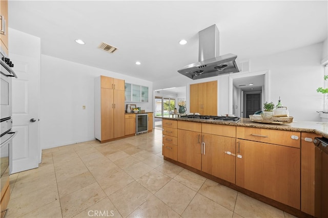 1212 Oakwood Dr, Arcadia, CA 91006 - kitchen featuring beverage cooler, island exhaust hood, stainless steel gas stovetop, recessed lighting, and stone countertops
