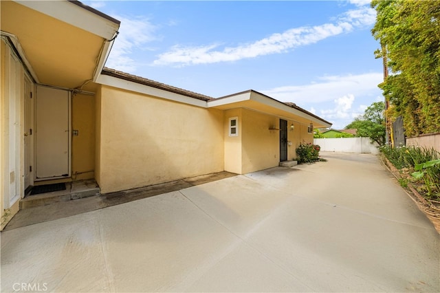 1212 Oakwood Dr, Arcadia, CA 91006 - property entrance featuring stucco siding, fence, and a patio area