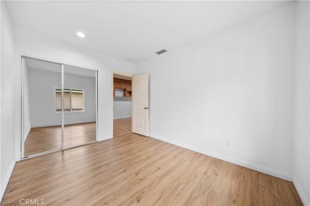 1212 Oakwood Dr, Arcadia, CA 91006 - unfurnished bedroom featuring a closet, light wood-style floors, baseboards, and recessed lighting