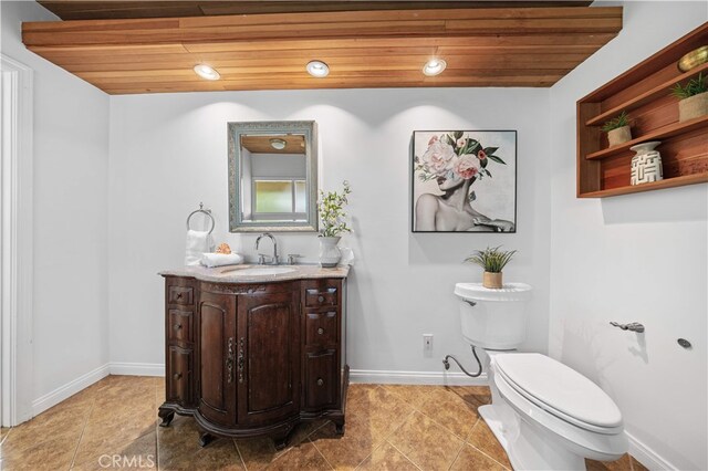 1212 Oakwood Dr, Arcadia, CA 91006 - bathroom featuring toilet, baseboards, wooden ceiling, tile patterned flooring, and recessed lighting