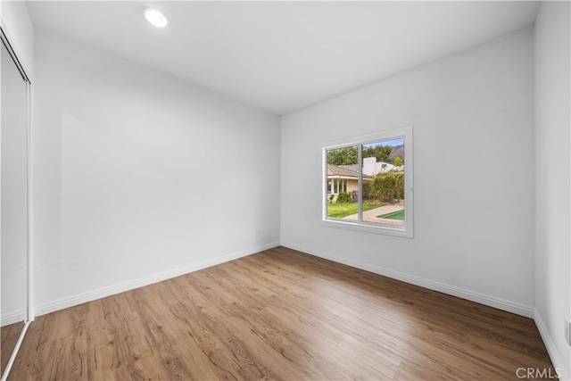 1212 Oakwood Dr, Arcadia, CA 91006 - unfurnished room with wood finished floors, baseboards, and recessed lighting