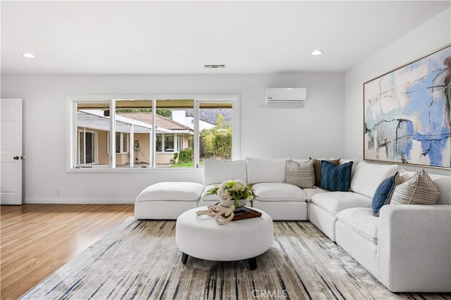 1212 Oakwood Dr, Arcadia, CA 91006 - living room with light wood-style floors, a wall mounted AC, recessed lighting, and baseboards