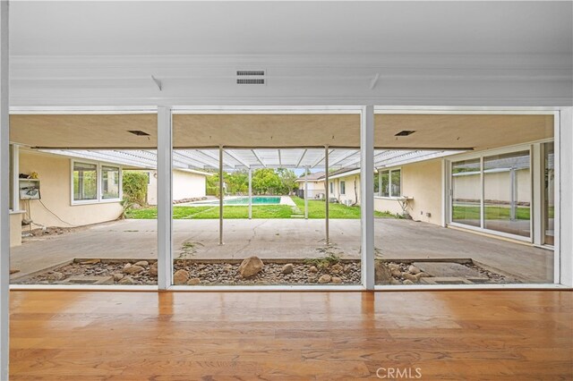 1212 Oakwood Dr, Arcadia, CA 91006 - doorway to outside featuring wood finished floors and crown molding