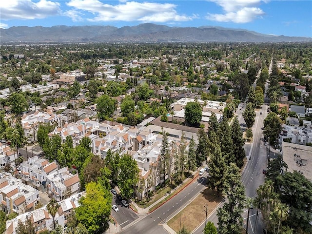 view of property location with mountains and nearby suburban area