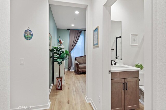 18100 Tableau Way, Saugus, CA 91350 - full bathroom featuring wood finished floors, vanity, recessed lighting, and baseboards