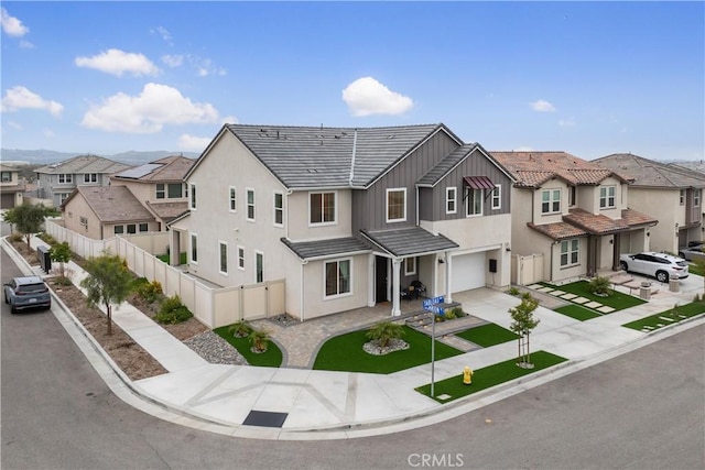 18100 Tableau Way, Saugus, CA 91350 - view of property with a garage, a residential view, concrete driveway, and stucco siding