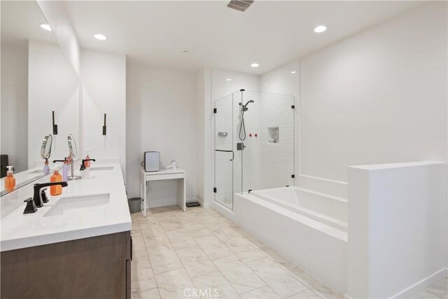 18100 Tableau Way, Saugus, CA 91350 - full bath with a shower stall, double vanity, a garden tub, marble look tiles, and recessed lighting