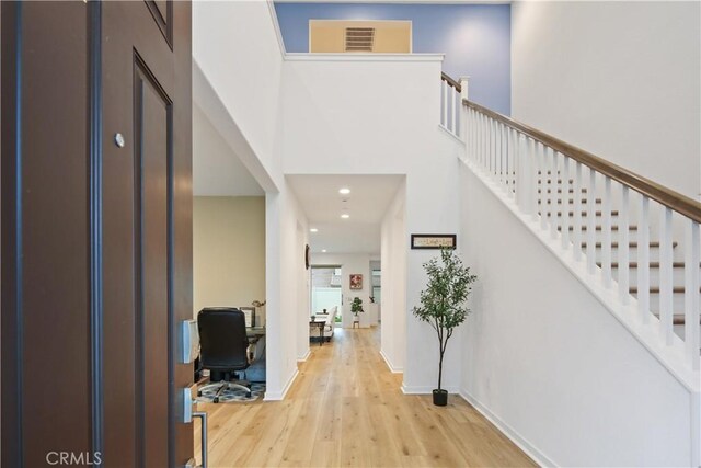 18100 Tableau Way, Saugus, CA 91350 - entrance foyer featuring wood finished floors, recessed lighting, stairs, a high ceiling, and baseboards