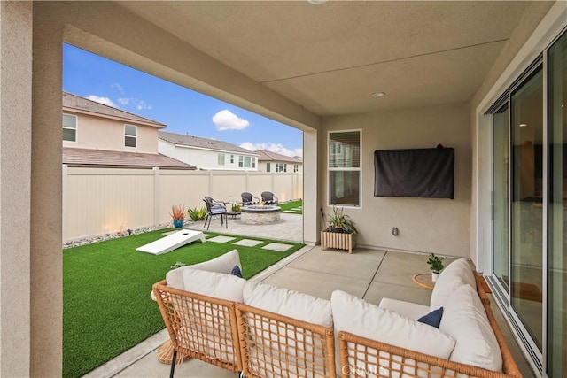 view of patio / terrace with an outdoor living space with a fire pit