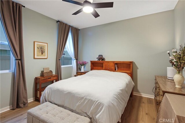 18100 Tableau Way, Saugus, CA 91350 - bedroom with light wood-style floors, baseboards, and a ceiling fan