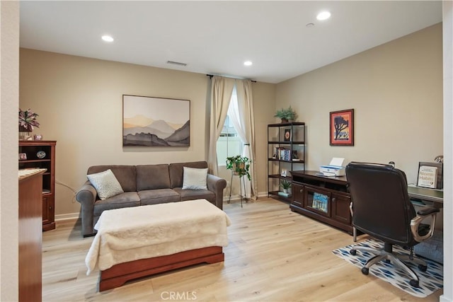 home office featuring light wood-style flooring, recessed lighting, and baseboards