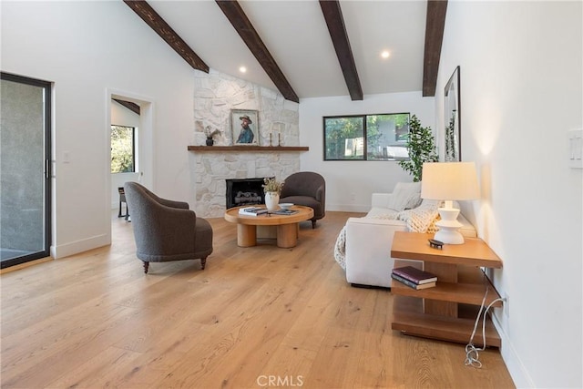 3250 Coldwater Canyon Ave, Studio City, CA 91604 - living room featuring healthy amount of natural light, baseboards, and a fireplace