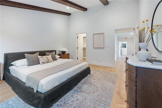 3250 Coldwater Canyon Ave, Studio City, CA 91604 - bedroom with light wood finished floors, beamed ceiling, baseboards, and high vaulted ceiling
