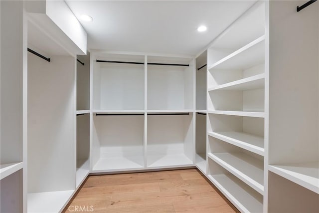 3250 Coldwater Canyon Ave, Studio City, CA 91604 - walk in closet with wood finished floors