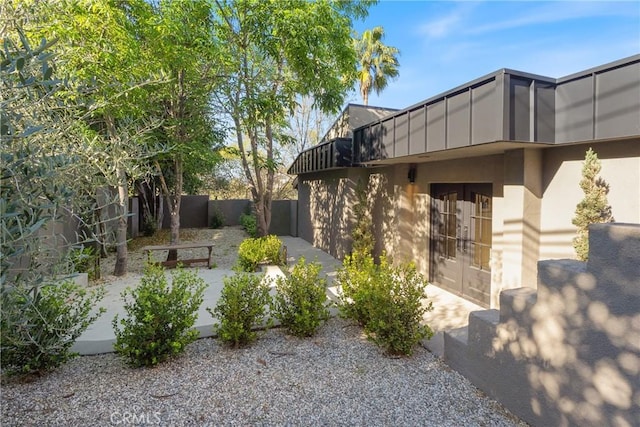3250 Coldwater Canyon Ave, Studio City, CA 91604 - view of yard featuring french doors, fence, a balcony, and a patio
