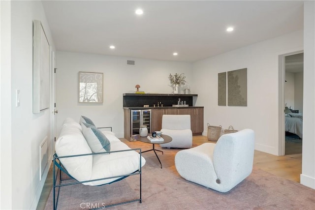 3250 Coldwater Canyon Ave, Studio City, CA 91604 - living room featuring beverage cooler, recessed lighting, wood finished floors, and baseboards