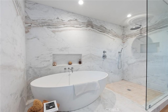 3250 Coldwater Canyon Ave, Studio City, CA 91604 - bathroom featuring marble tiled flooring, a marble finish shower, a freestanding tub, recessed lighting, and tile walls
