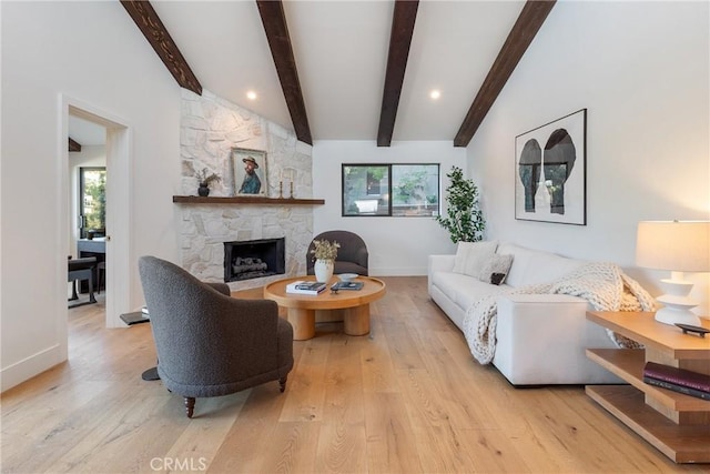 3250 Coldwater Canyon Ave, Studio City, CA 91604 - living area featuring baseboards, wood finished floors, and a stone fireplace