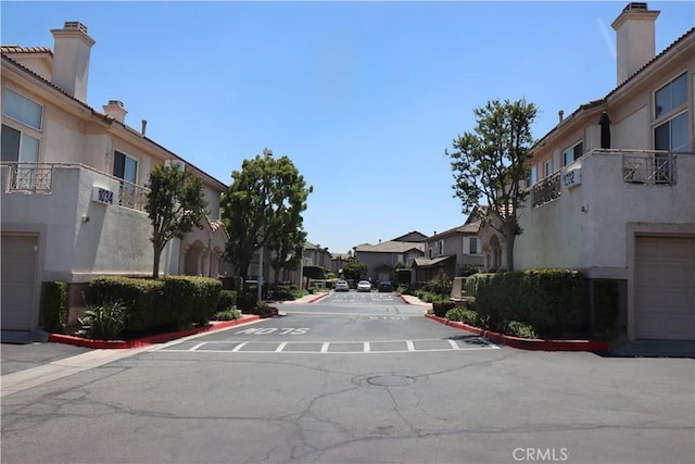 1044 Turner Ave Unit 207, Ontario, CA 91764 - view of asphalt road with a residential view and curbs