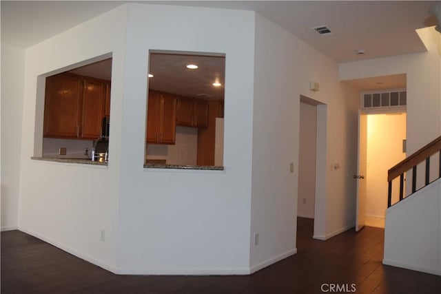 1044 Turner Ave Unit 207, Ontario, CA 91764 - hallway with dark wood finished floors, baseboards, recessed lighting, and stairway