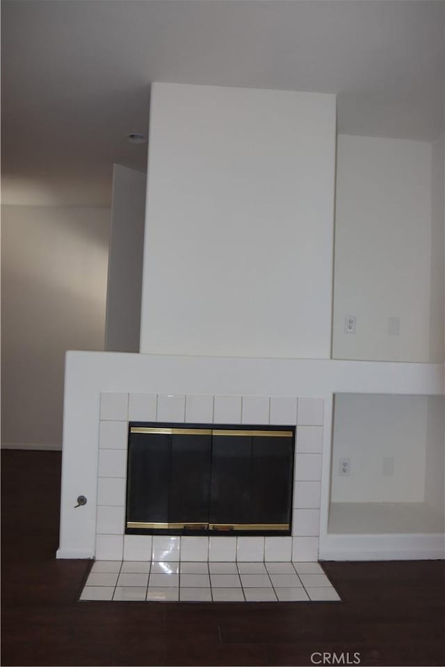 1044 Turner Ave Unit 207, Ontario, CA 91764 - detailed view of wood finished floors and a tile fireplace