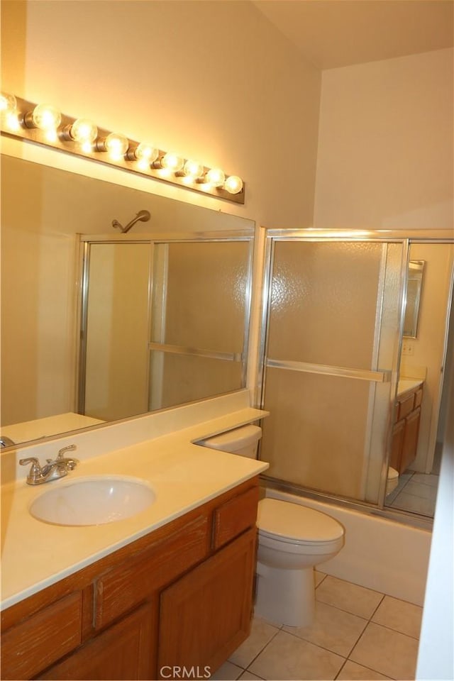 1044 Turner Ave Unit 207, Ontario, CA 91764 - bathroom with vanity, tile patterned floors, combined bath / shower with glass door, and toilet